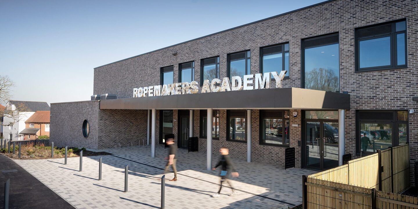 Secondary school entrance to brick clad school with large letters spelling Ropemakers Academy.