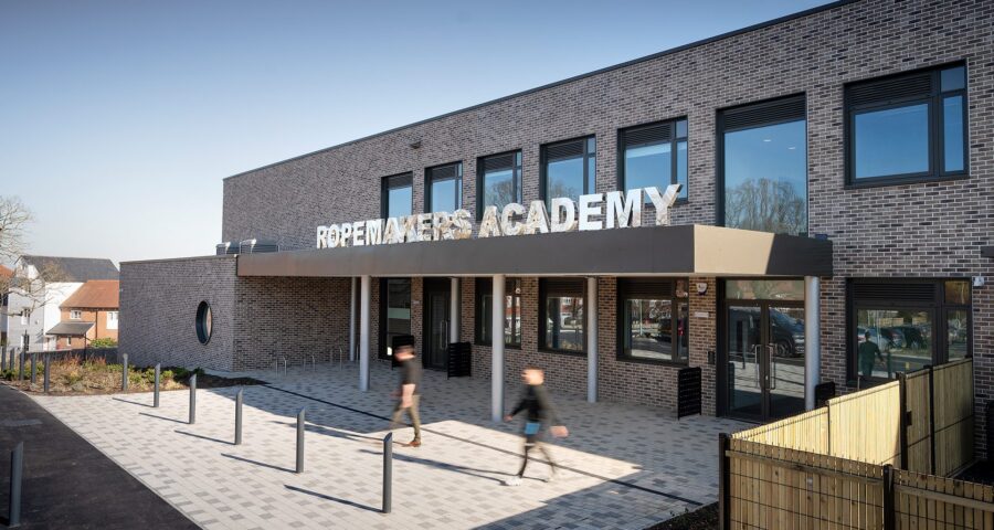 Secondary school entrance to brick clad school with large letters spelling Ropemakers Academy.