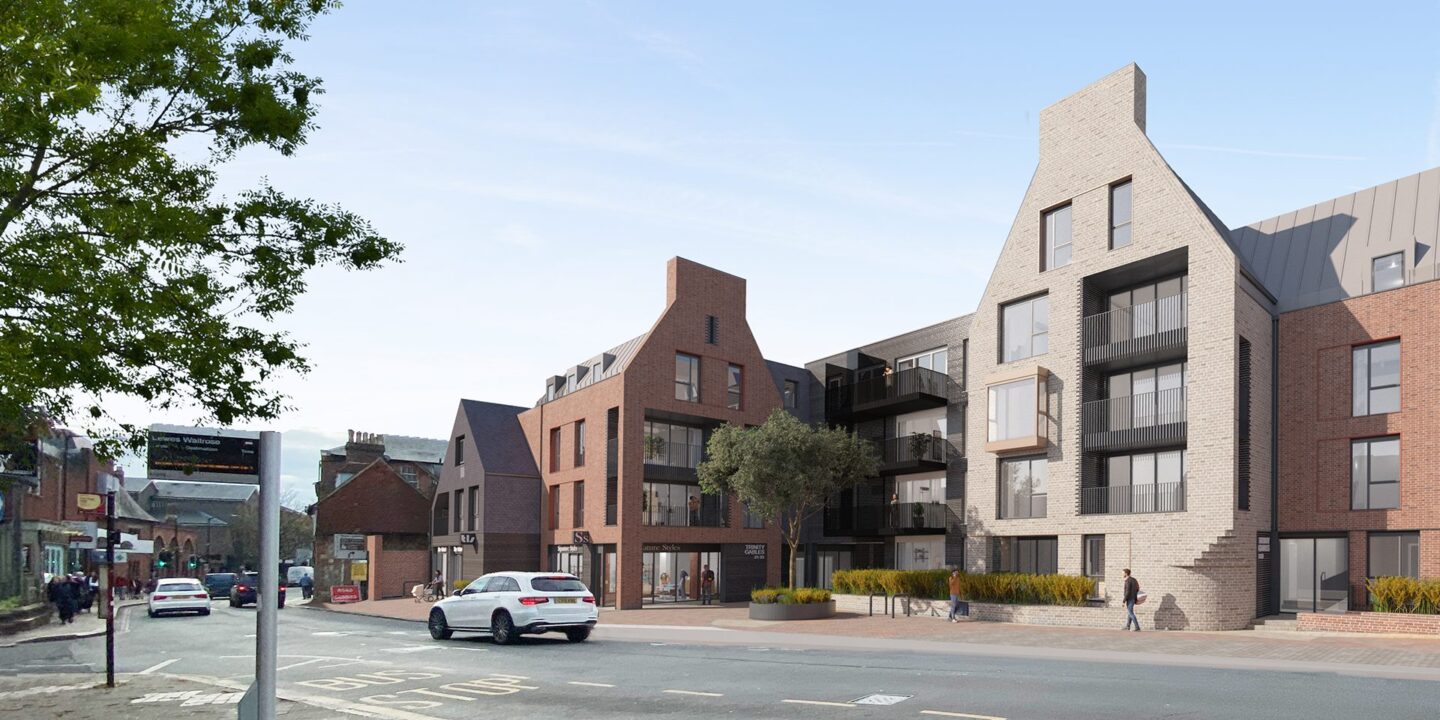 CGI of residential development in a contemporary style with gables in a mix of red and grey brick and darker cladding.