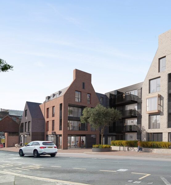 CGI of residential development in a contemporary style with gables in a mix of red and grey brick and darker cladding.