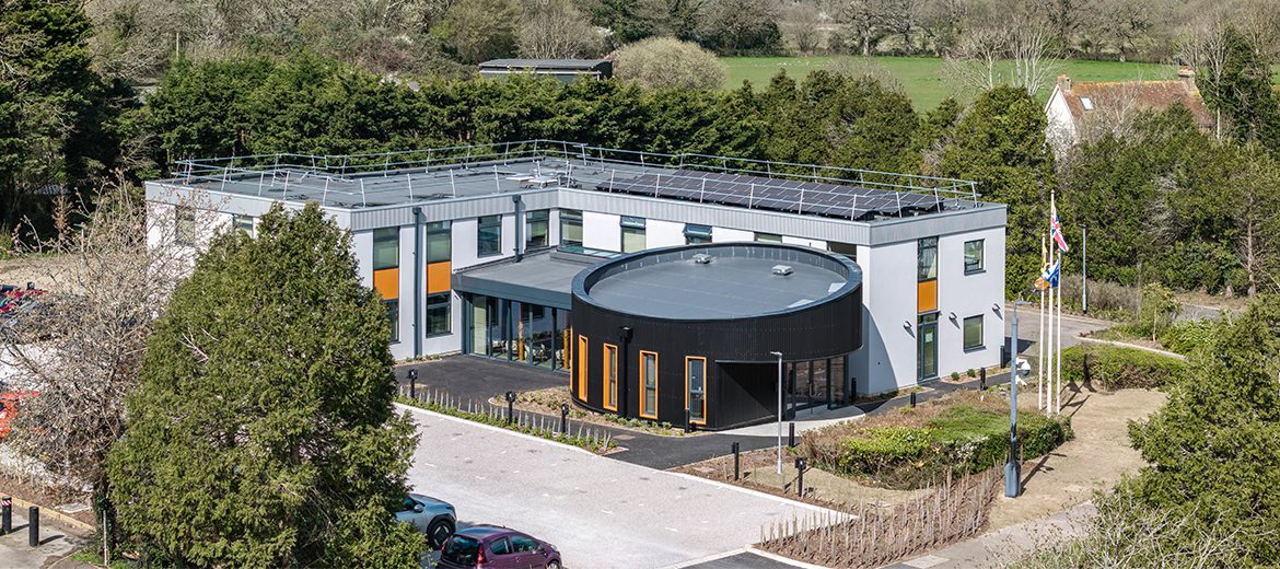 Birds view of a retrofit office building with a car park at the front