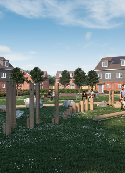 A green playground with children playing, surrounded by houses.