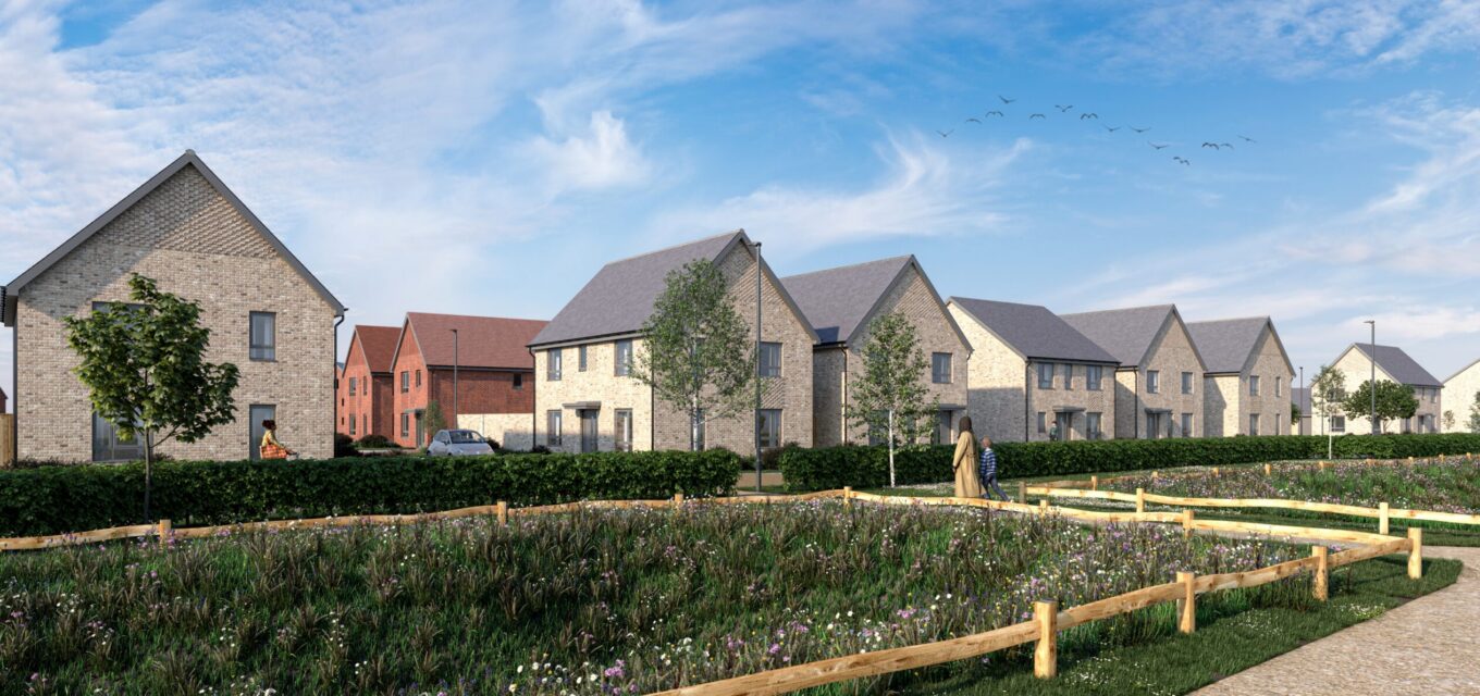 Group of residential houses behind a green verge and a pathway